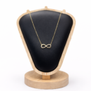 women in Infinity shape studded with cz stone necklace 